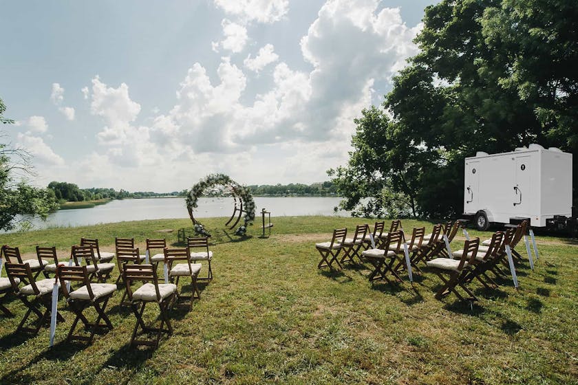 PortaPros toilet trailer at lakeside wedding.