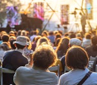 Couple enjoying an outdoor concert.
