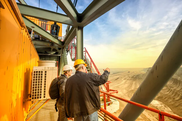 Miners assessing a work site in the field